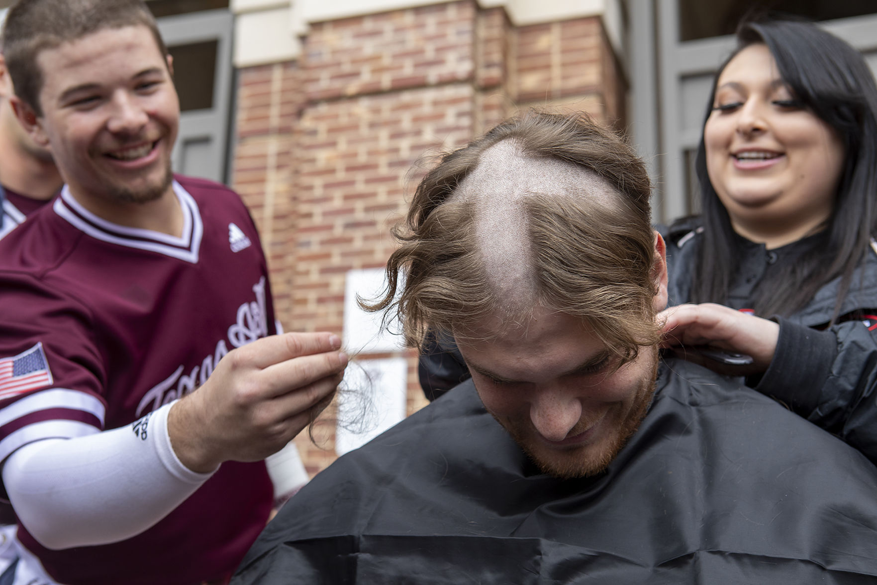 A&M baseball head shaving for cancer